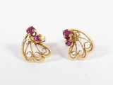 a pair of gold and ruby earrings