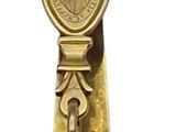 a gold bell with a metal handle on a white background