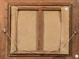 an old picture frame with a piece of paper taped to it