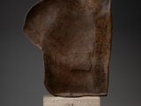 an image of a sculpture of a man ' s head on a marble block