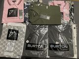 a lot of t - shirts that are on a table