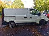a white van that is parked on the side of the road