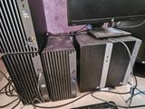 a lot of computer equipment that are on the floor