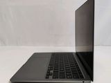 an open laptop computer sitting on top of a white table