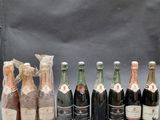 six bottles of champagne are lined up in a row on a gray background