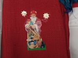 red sweater with a picture of a santa claus on it