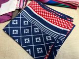many different types of ties laid out on a table