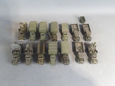 a lot of military vehicles that are sitting on a table