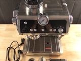 an image of a coffee machine on a wooden table
