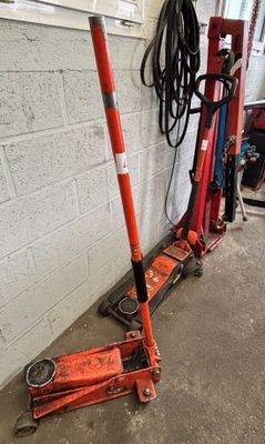two jacks sitting next to each other in a garage