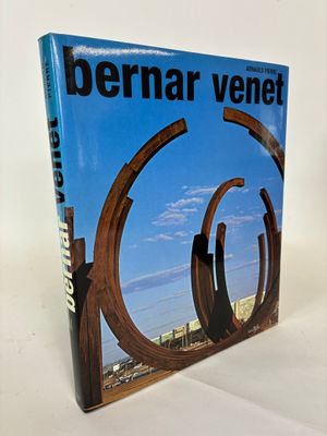 the book is sitting on a white surface with a blue sky in the background