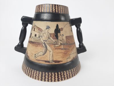 a vase with a picture of a baseball player on it