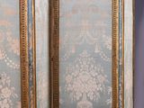 a room divider with a floral design on it