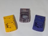 three toy cars that are sitting on a white surface