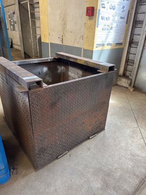 a metal box that is sitting in the middle of the floor