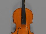 un vieux violon et un archet accrochés au mur