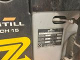 a close up of a machine that is sitting on the ground