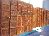 many old books on display in a glass case