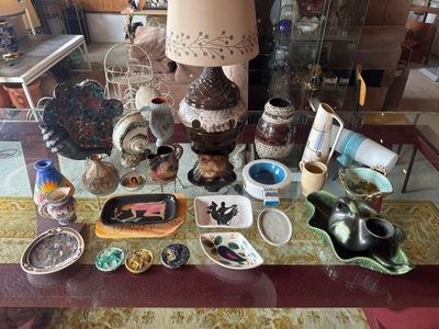 a glass table with a lot of different items on it