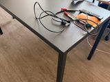 a table with a keyboard and a mouse on it