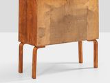 the sideboard is made of wood and has two legs
