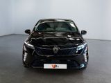 the front view of a black car parked in a white room