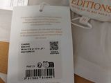 a label on a white shirt that says editions