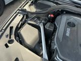 a bmw engine in the trunk of a car