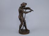 bronze statue of a man with a gun on a white background