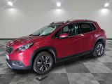 une Toyota RAV rouge de 2019 garée dans un garage