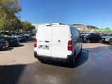 a white van that is parked in a parking lot