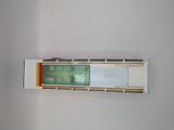 a toy bus that is sitting on a white surface