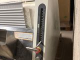 a toaster that is sitting on a pallet in a room