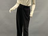 an image of a mannequin wearing a white shirt and black pants