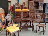 several pieces of furniture are sitting in a room with a lot of boxes