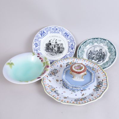several plates with different designs and designs on them sitting on a table