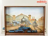 a picture of a train on display in a wooden frame