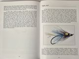 an open book with a picture of a fly on it