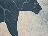 a painting of a black panther on the side of a building