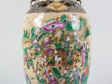 an image of a vase with a painting on it sitting on a table