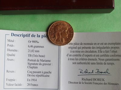 a picture of a piece of paper with a coin on top of it
