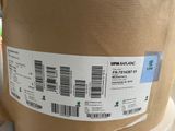 a large roll of brown paper with a barcode on it