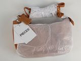 the small purse is wrapped in plastic and has a tag on it