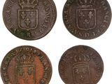 four old coins with a coat of arms and a crown on them