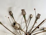 an image of a metal sculpture of a dandelier