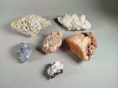 several different types of rocks and crystals on a table