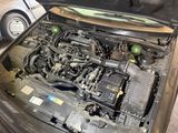 a car that has its hood open with the engine in it
