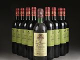 six bottles of red wine are lined up in a row