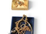 an assortment of jewelry including a necklace, earrings, and a ring