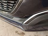 a close up of a car ' s front bumper and grille